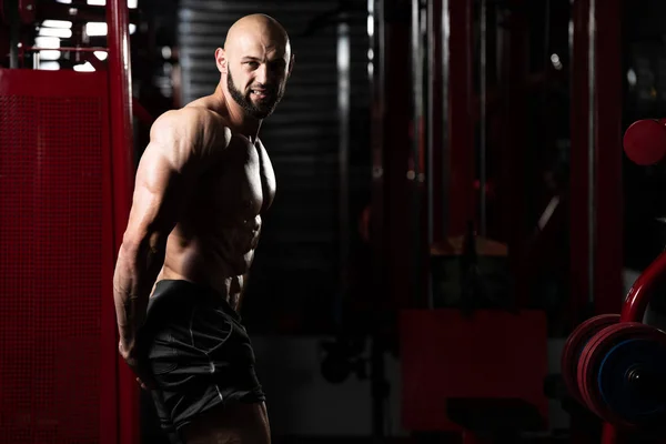 Bodybuilder Performing Side Triceps Pose — Stock Photo, Image