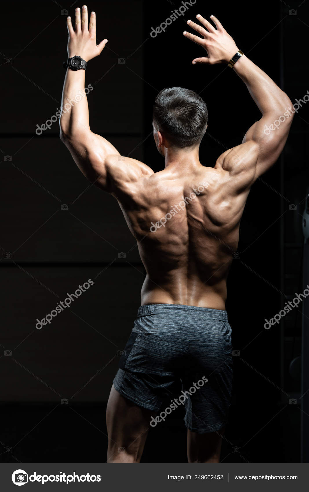 Rear view of a man standing with arms... | Man standing, Standing poses,  Figure poses