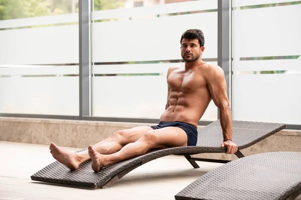 Young Man Lying On A Sun Lounger — Stock Photo, Image