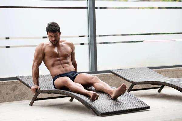 Young Man Lying On A Sun Lounger — Stock Photo, Image