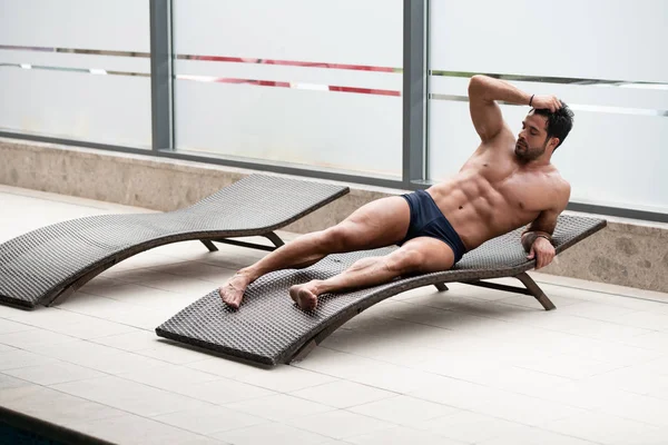 Young Man Lying On A Sun Lounger — Stock Photo, Image