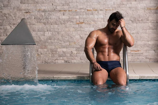 Young Looking Macho Man At Hotel Indoor Pool — Stock Photo, Image