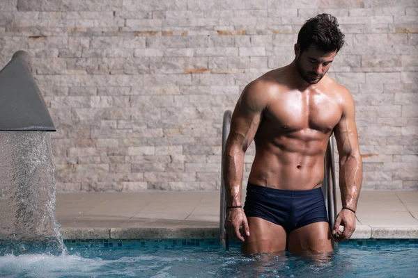 Young Looking Macho Man At Hotel Indoor Pool — Stock Photo, Image