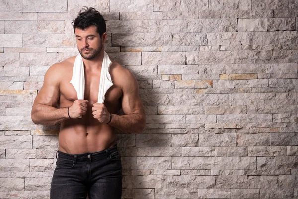 Portrait of Model Man Standing Near the Wall