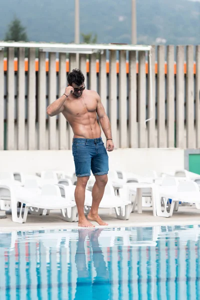 Young Muscular Man At Swimming Outdoor Pool — Stock Photo, Image