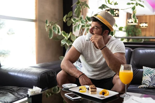 Man Drinking Coffee in a Hotel Lobby Bar — Stock Photo, Image