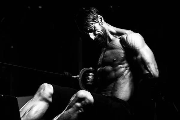 Mature Man Exercising Back On Machine — Stock Photo, Image