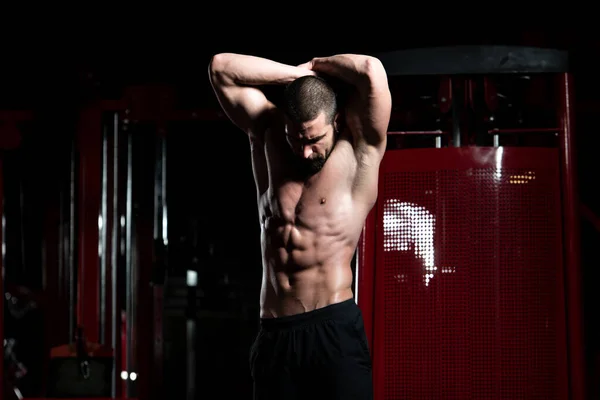 Bodybuilder Flexing Muscles — Stock Photo, Image