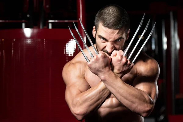 Superhero With Claws Flexing Muscles in Fitness center — Stock Photo, Image