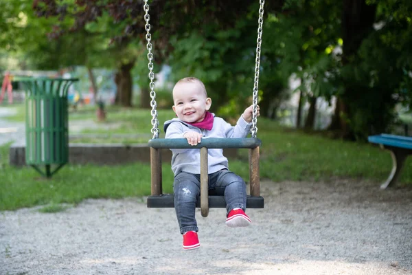 Happy Laughing Toddler Boy Having Fun Swing Enjoying Day Playground — стоковое фото