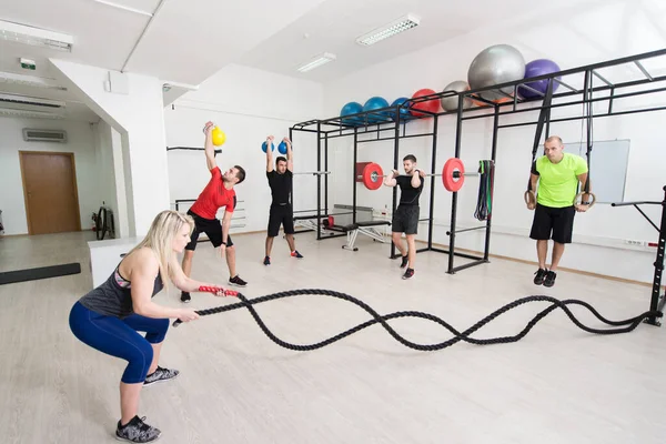 Group Young Sporting Adults Training Athletic Field Barred Window — Stock Photo, Image