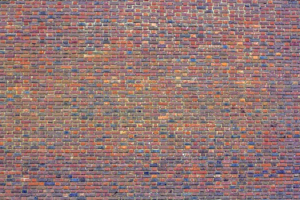 A texture of brick wall. European brickwork. Large red brick wall. — Stock Photo, Image