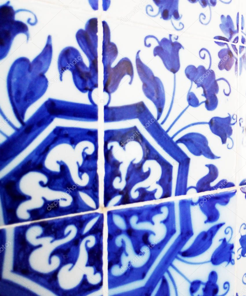 Mosaic tiles, Portugal Azulejo Classic and Traditional. Blue Patterned wall, medieval ceramics tiles, heritage. Painted panel with a round geometric pattern. Mauritanian Wall