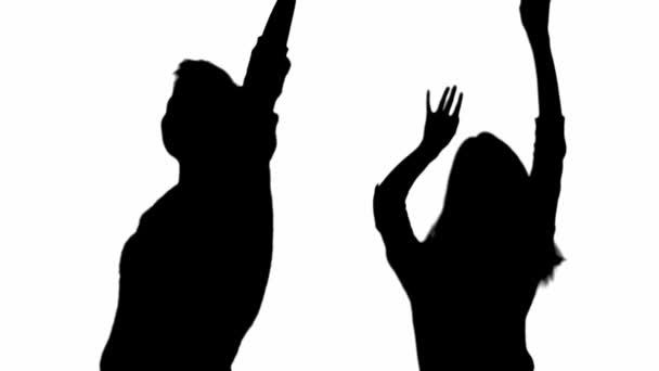 Twee Silhouetten Van Gelukkige Vrouwen Zwaaien Handen Dansen Geïsoleerd Wit — Stockvideo