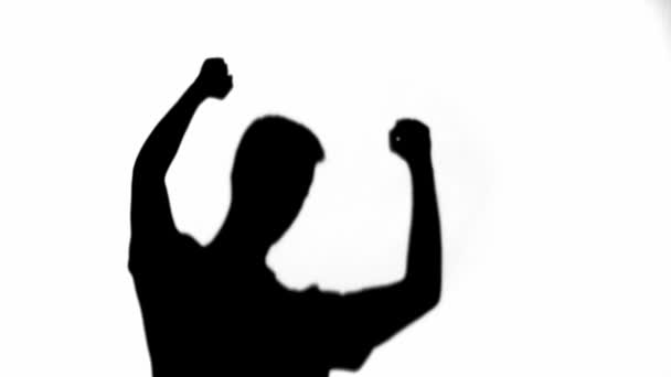 幸福的男人的剪影显示是的手势和跳舞在白色 — 图库视频影像