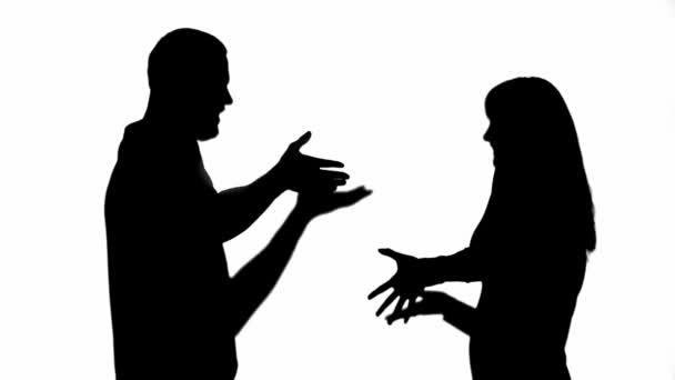 Side View Two Silhouettes Couple Quarreling Waving Hands Isolated White — Stock Video