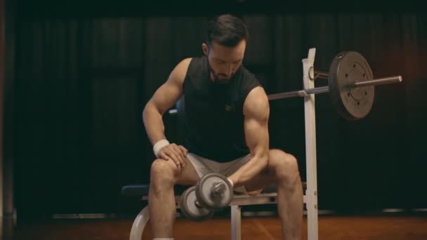 Concentrated Muscular Sportsman White Shorts Doing Biceps Curls Lowering Dumbbell — Stock Video