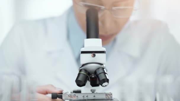 Selective Focus African American Scientist Glasses Using Microscope Back Light — Stock Video