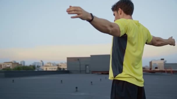 Sportsman Yellow Sportswear Warming Raised Hands Bend Aside Stretching Rooftop — Stock Video