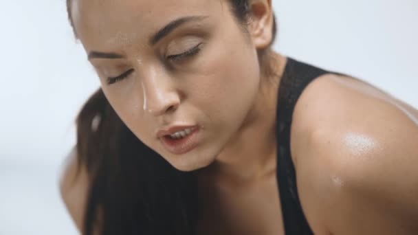 Beautiful Tired Sportswoman Wiping Sweat Forehead Looking Camera Breathing Heavily — Stock Video