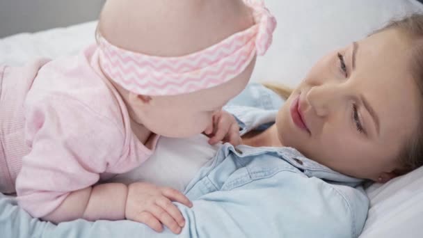 Selective Focus Infant Touching Clothes Mother — Stock Video