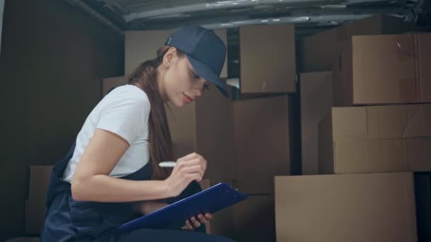 Delivery Woman Checking Boxes Writing Clipboard — Stock Video
