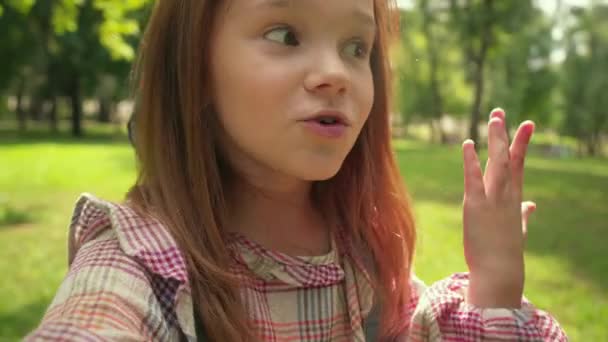 Cute Redhead Child Talking Camera Waving Hand — Stock Video