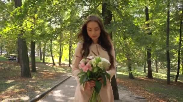 Pretty Young Woman Bouquet Walking Park — Stock Video