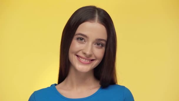 Attractive Girl Winking Eye Isolated Yellow — Stock Video