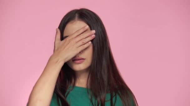 Scared Woman Covering Face Isolated Pink — Stock Video