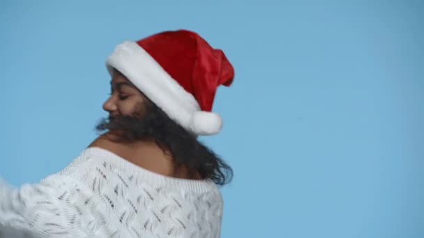 Happy African American Woman Santa Hat Dancing Isolated Blue — Stock Video