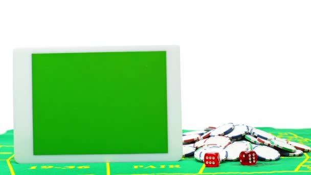 Tableta Digital Con Pantalla Verde Cerca Fichas Póquer Dados Aislados — Vídeos de Stock