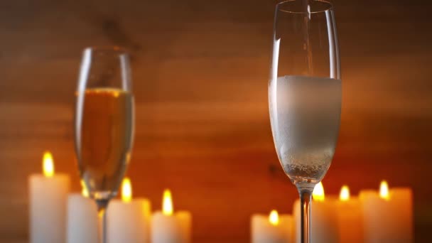 Sparkling Wine Pouring Champagne Glass Burning Candles — Stock Video