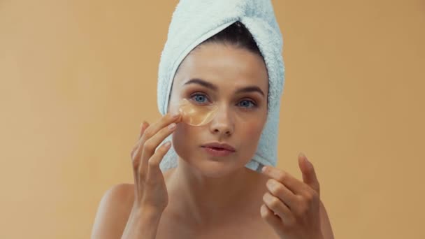 Beautiful Girl Towel Head Applying Collagen Pads Isolated Beige — Stock Video