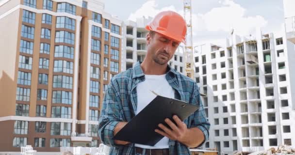 Handsome Builder Writing Clipboard Construction Site — Stock Video