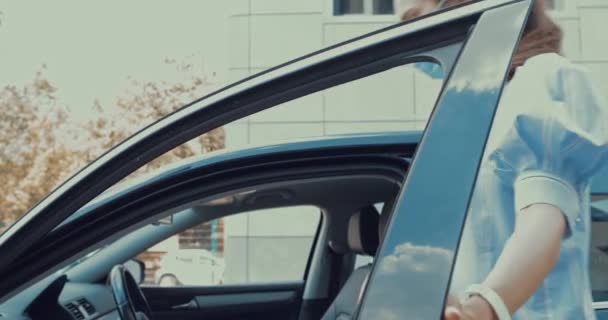 Young Woman Getting Car Taking Medical Mask — Stock Video