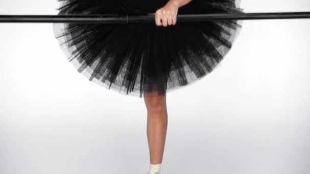 Young Ballerina Practicing Ballet Moves Black Barre White Background — Stock Video