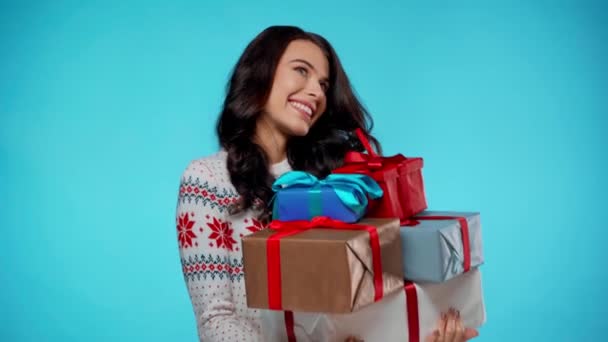 Happy Young Adult Woman Holding Bunch Gift Boxes Blue Background — Stock Video