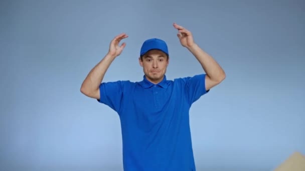 Confused Delivery Man Dropping Carton Boxes Showing Shrug Gesture Grey — Stock Video