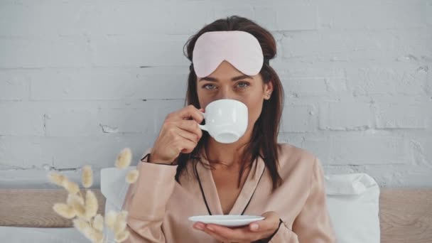 Brunette Woman Drinking Coffee Bed Looking Camera — Stock Video