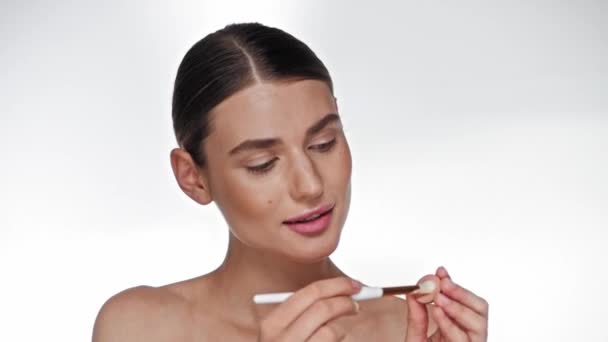 Young Adult Woman Applying Eye Shadow Cosmetic Brush White — Stock Video