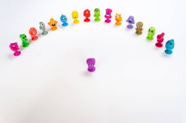 Baby kids toys background. Colorful toy monsters for baby kids. Space for text clipart