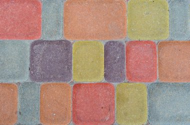 Dikdörtgen kaldırım döşemesi. Pastel arka plan. Yuvarlak köşeli çok renkli kaldırım levhaları