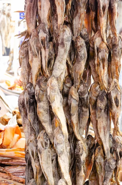 Odessa, Ukraine - July 18, 2019. Privoz market. Bundles of dried gobies hanging on a market counter — Stock Photo, Image