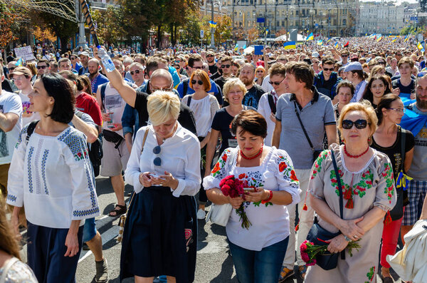 Kyiv, Ukraine - August 24, 2019. Khreschatyk st. Veterans March. People are dressed in Ukrainian embroidered shirts. Ukrainian flags. Ukraine's Independence Day