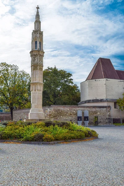 Abandoned street in smal town in Vienna Austria with blue sky and catholic church and paving stone — Stock Photo, Image