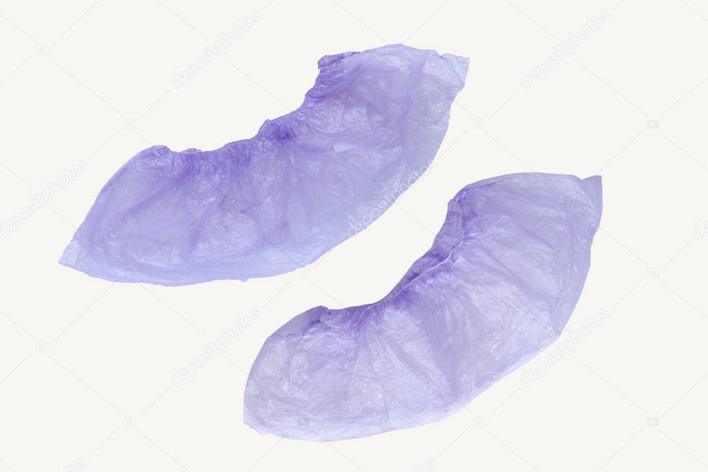 Two medical purple shoe covers overshoes isolated on white background. Catalog top view