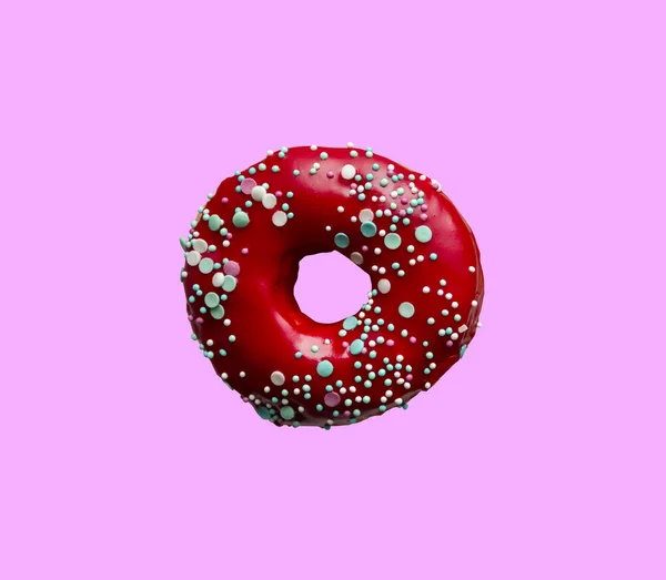 Red donut with pastry topping isolated on pink background