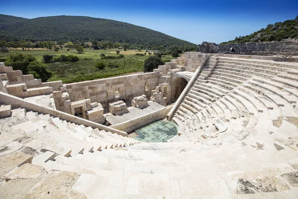 stock image Patara (Pttra). Ruins of the ancient Lycian city Patara. Amphi-theatre and the assembly hall of Lycia public. Patara was at the Lycia (Lycian) League's capital. Aerial view shooting. Antalya, TURKEY