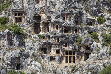 Archeological remains of the Lycian rock cut tombs in Myra, Turkey clipart